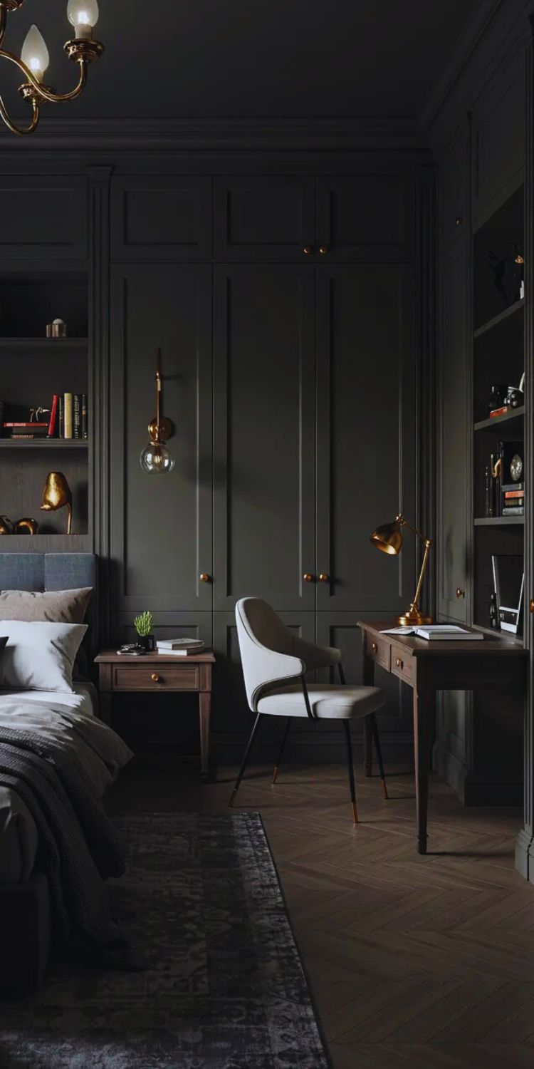 Sophisticated dark academia bedroom with forest green built-in cabinetry, brass chandelier and desk lamp, integrated workspace with white modern chair, dark wood flooring, layered bedding in neutral tones, and moody lighting creating an elegant scholarly atmosphere perfect for reading and working.
