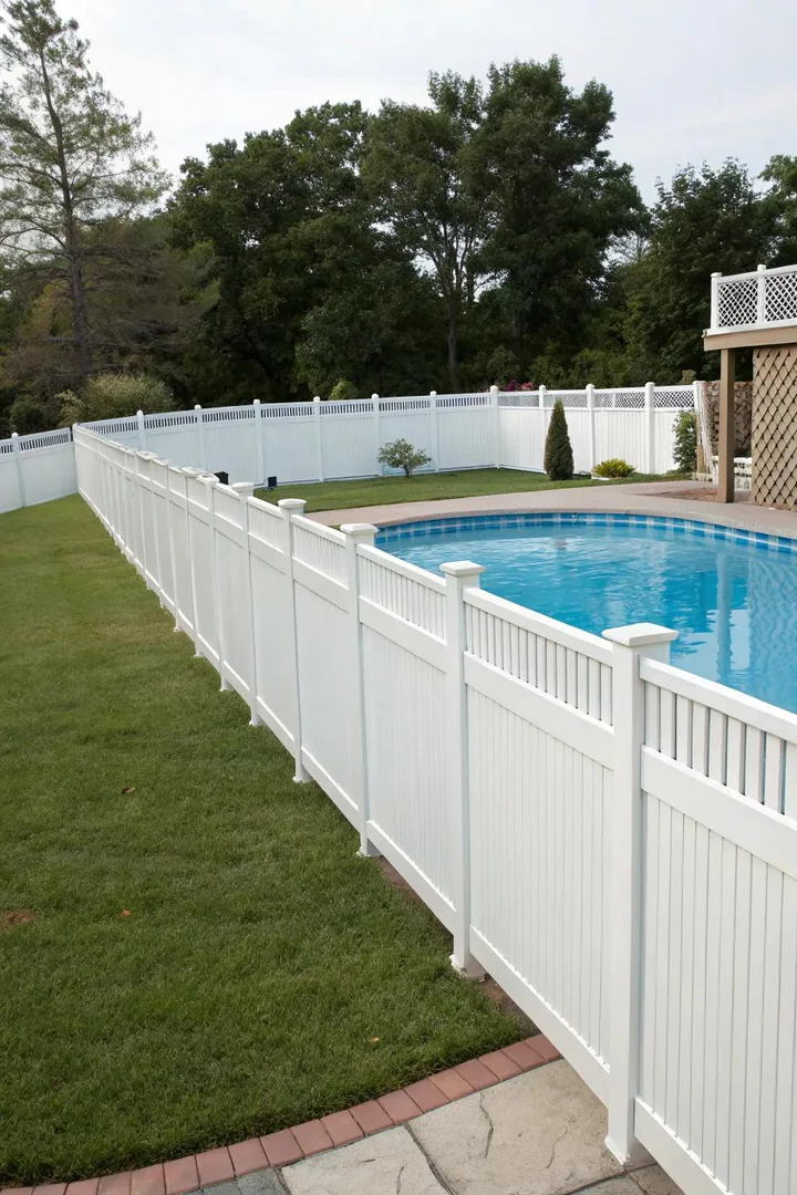 above-ground pool deck with white vinyl railing system and solar post cap lights