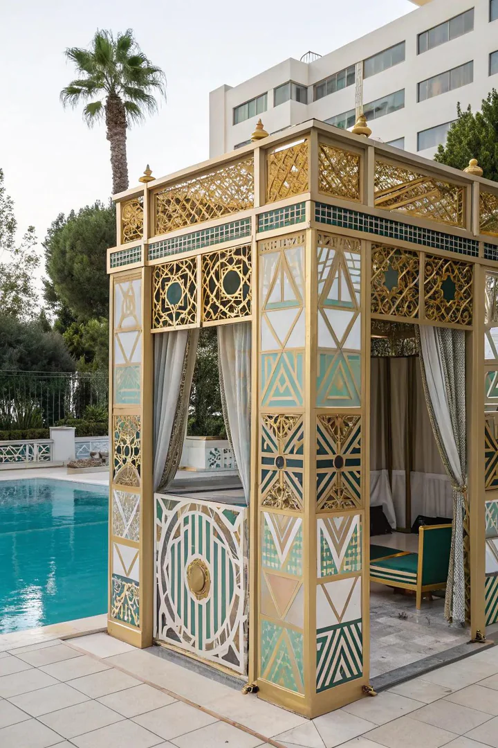 Art Deco-style pool cabana with geometric patterns, bold colors, and metallic accents