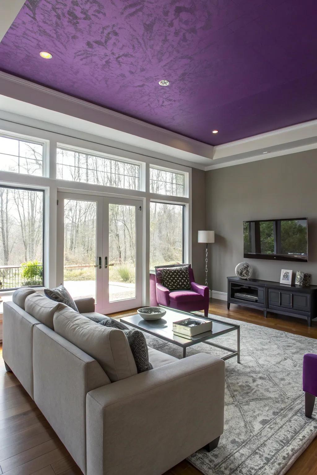 A purple ceiling creating an unexpected design element in the living room.