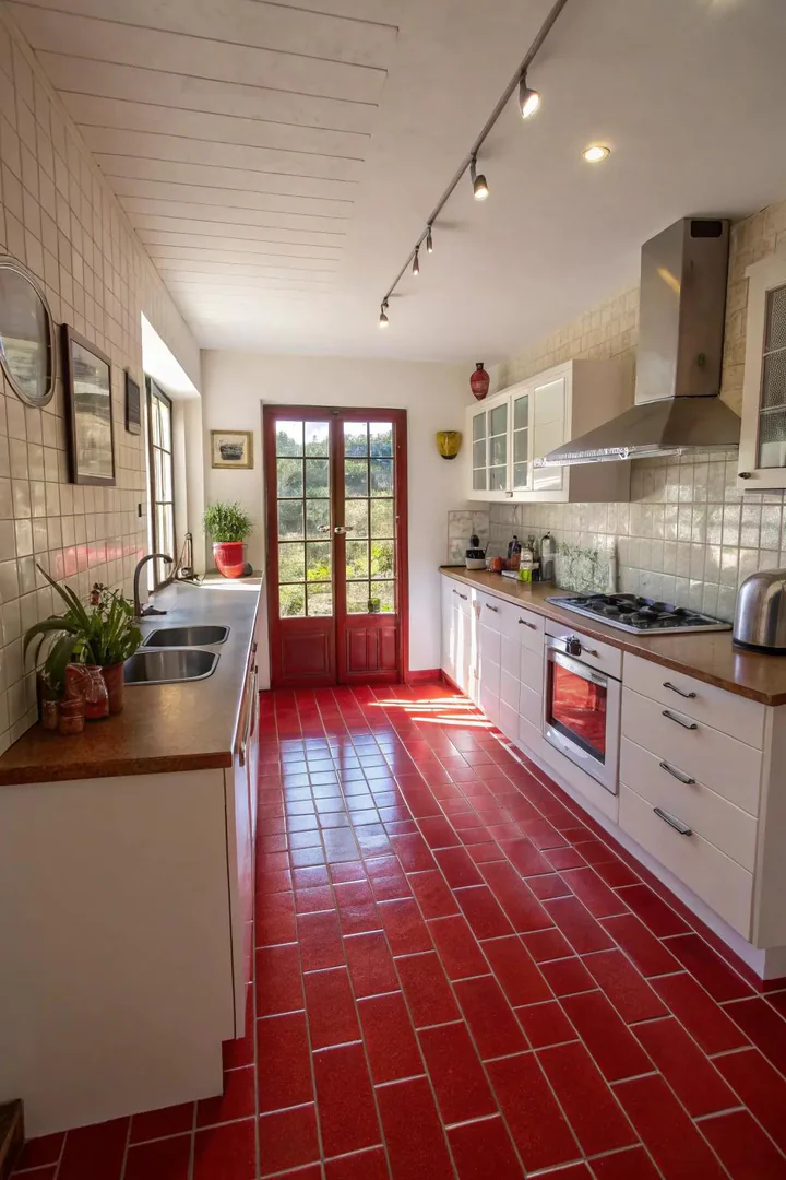 Red flooring in a kitchen.