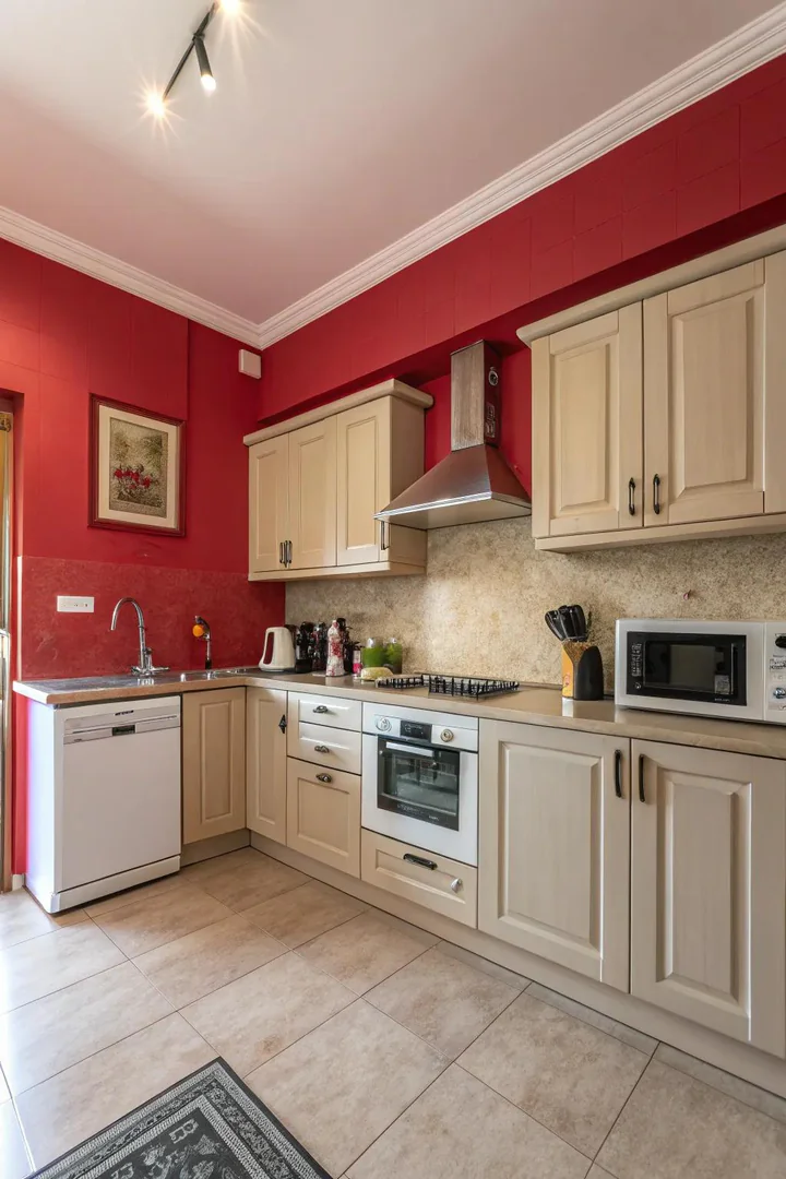 Energetic red painted walls in a kitchen.