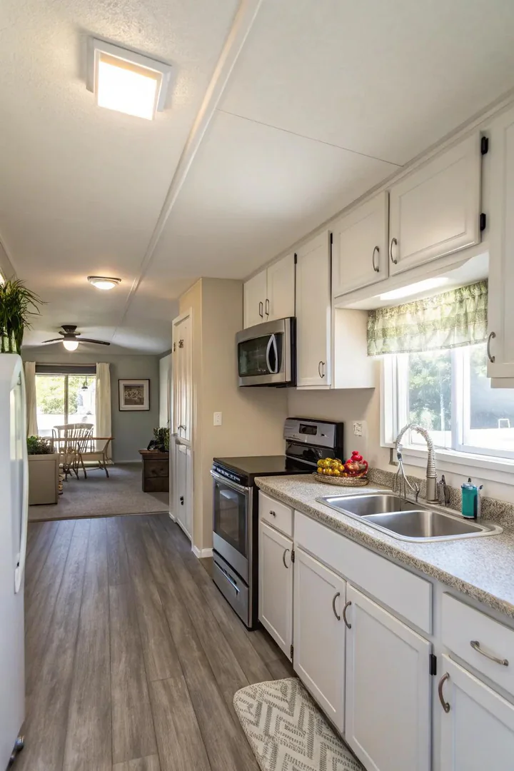 Mobile home kitchen brightened with fresh paint.